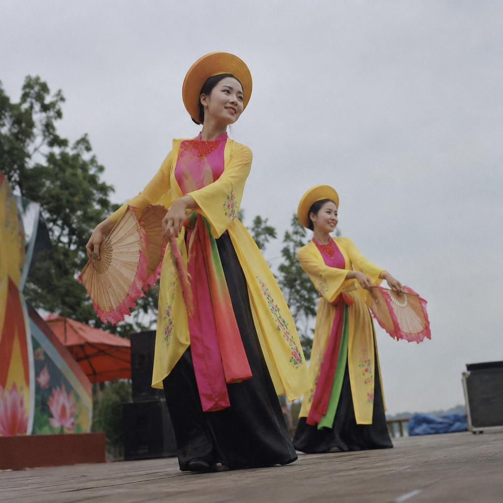 A group performing a traditional Vietnamese dance in vibrant costumes